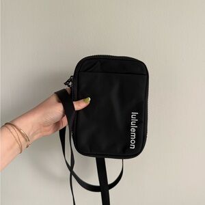 Lululemon NWT black crossbody pouch with logo